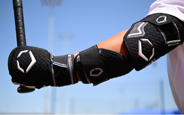 A close-up of a person wearing elbow pads
      
      Description automatically generated