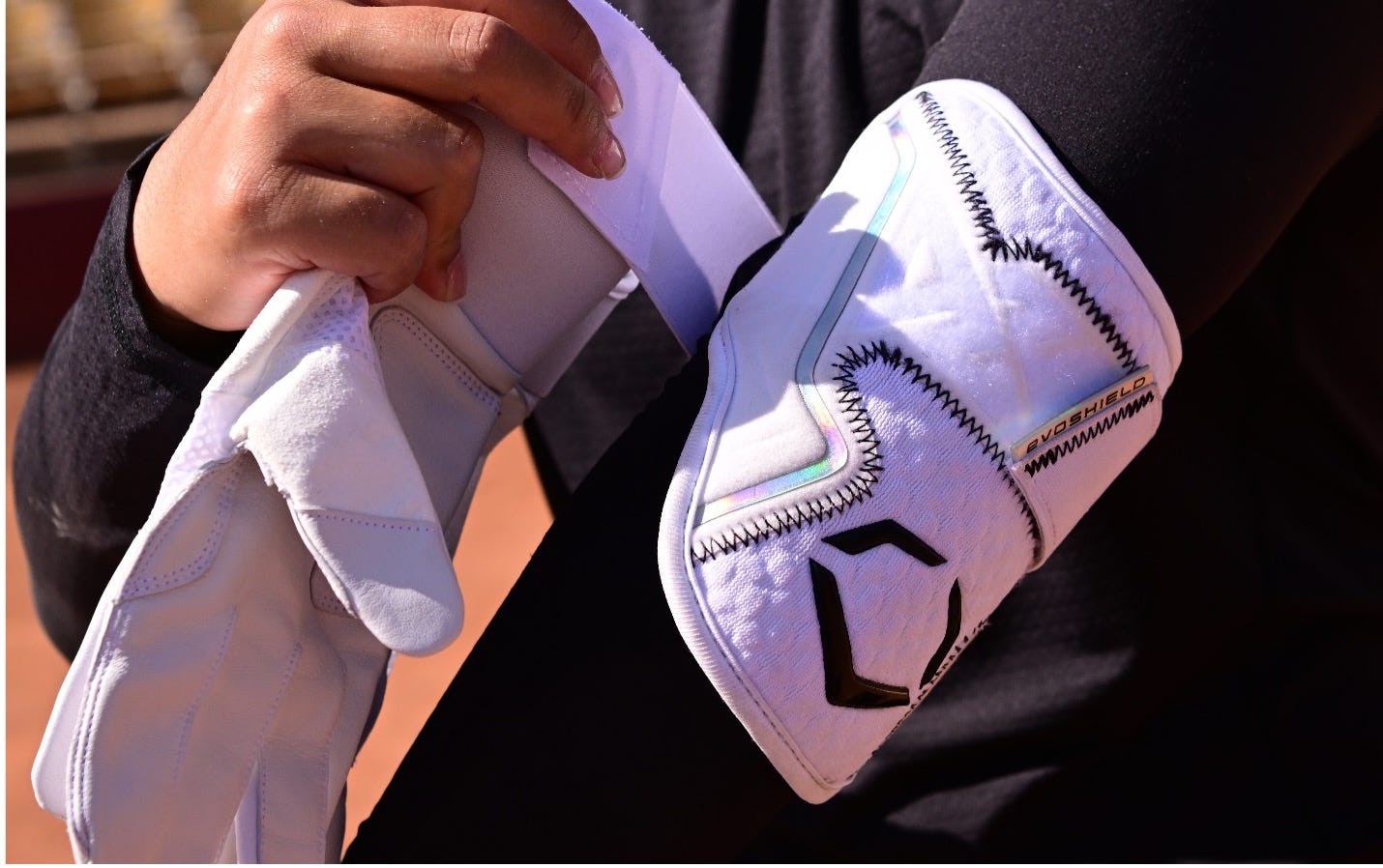 A person wearing a white glove
      
      Description automatically generated