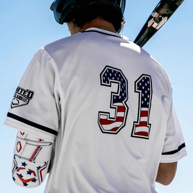 Baseball batter with bat resting on shoulder
